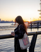 Load image into Gallery viewer, "Creativity is contagious" art quote on a tote bag in a wavy text effect