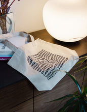Load image into Gallery viewer, Tote bag with a wavy distorted art quote