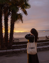 Load image into Gallery viewer, Casa Muze on a tote bag with a distressed ink bleed effect