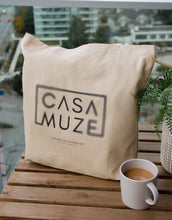 Load image into Gallery viewer, Cas Muze logo with a radial blur effect on a canvas tote bag