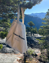 Load image into Gallery viewer, Blurry text effect graphic design on a tote bag