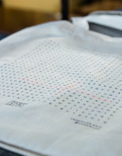 Load image into Gallery viewer, Minimalist tote bag design featuring a word search