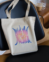 Load image into Gallery viewer, &quot;Change Your Perspective&quot; art quote on a tote bag in a purple gradient
