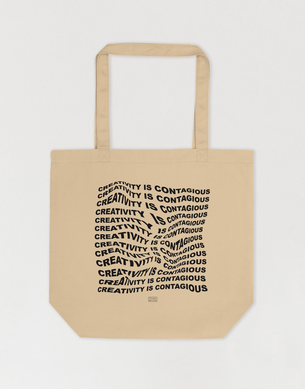 Wavy text effect of an art quote on a tote bag