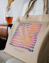 Load image into Gallery viewer, &quot;Creativity Is Contagious&quot; warped text effect art quote tote bag
