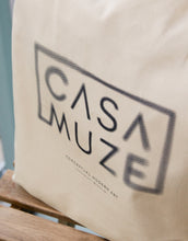 Load image into Gallery viewer, Blurry casa muze logo on a canvas tote bag
